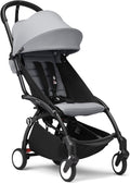 Cochecito compacto para bebé - Chasis negro y asiento color Stone - Arnés de 5 puntos y estructura ligera - Plegado rápido compatible con equipaje de mano